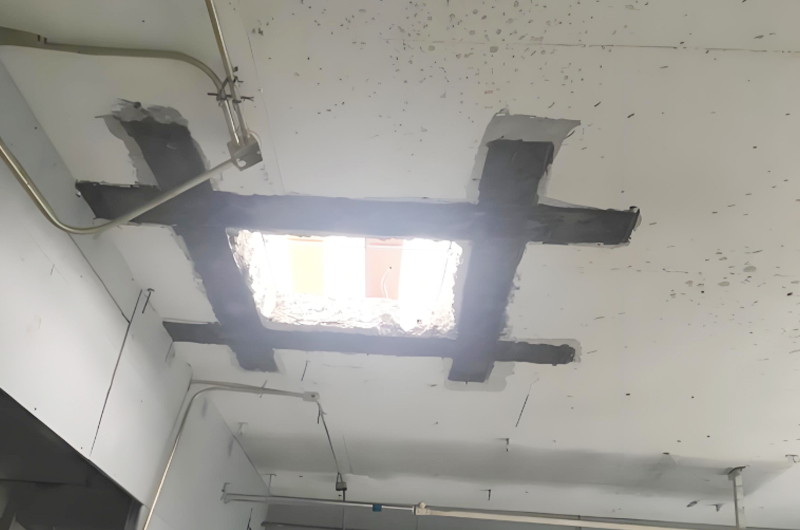 現(xiàn)澆樓板開(kāi)洞粘接碳布加固